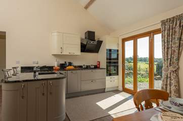 The kitchen-area has its own set of French windows.