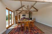 The open plan living-room has the original beams for perfect character.