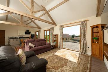 This shows another view of the sitting-room. There is an attractive pebble-effect gas fire set into the wall.