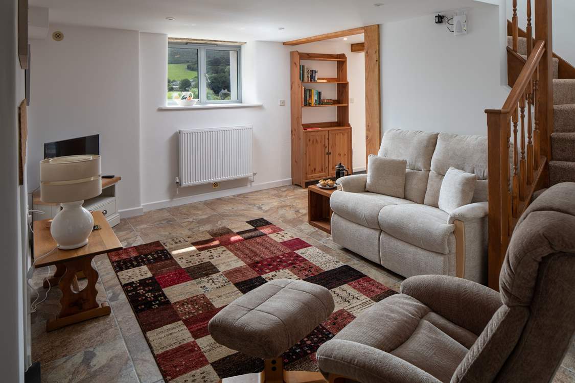The sitting-room leads up to the first floor bedroom.