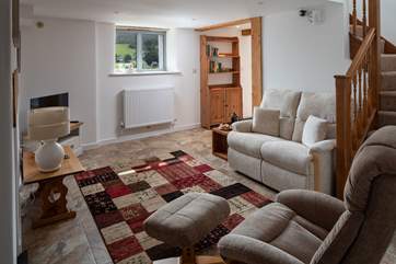 The sitting-room leads up to the first floor bedroom.