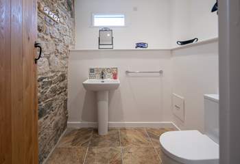 The ground floor WC is accessed via the sitting-room and is up a small flight of steps.