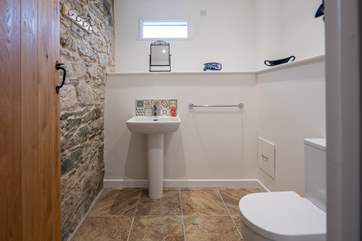 The ground floor WC is accessed via the sitting-room and is up a small flight of steps.