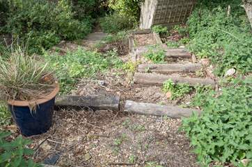 Here is the unmade track that leads to the beach - please take care on the steps.