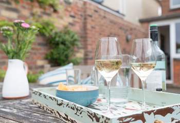 Enjoy the afternoon sun with a glass of something nice!