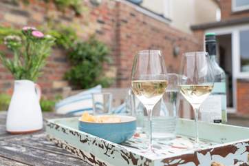 Enjoy the afternoon sun with a glass of something nice!
