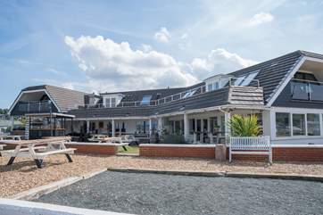With a fabulous outdoor seating area looking out to sea.