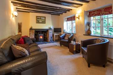 The cosy sitting-room is perfect for snuggling up in following a full day of adventure.
