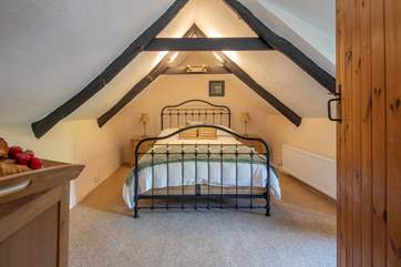 Bedroom 2 on the first floor is super inviting, however please do mind your head on the beautiful beams.