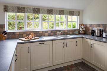 The kitchen has a fabulous leafy view.