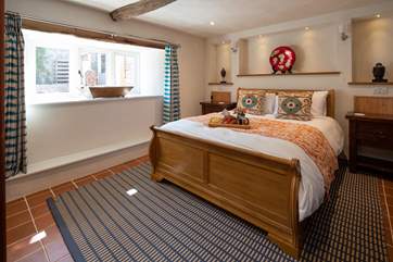 Bedroom 1 on the ground floor is a glorious place to retreat to at night time. Designed with the utmost luxury and style in mind, this fabulous king-size bed is the icing on the cake.