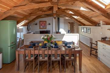 From the kitchen-area, looking back through to the sitting-area and bedroom 4 beyond.