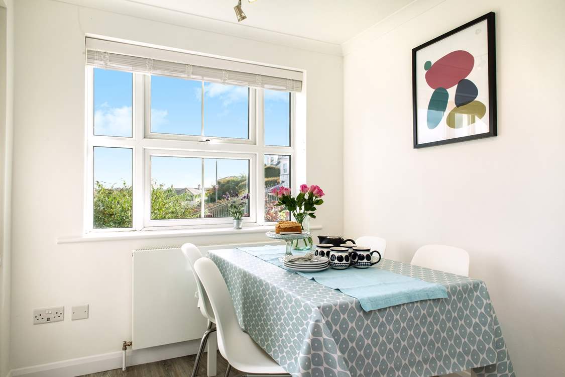 The dining-area with its panoramic view of the bustling estuary.