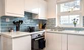 The stylish kitchen is light and airy.  - Thumbnail Image