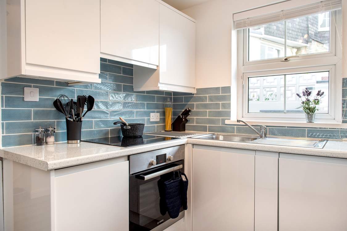 The stylish kitchen is light and airy.