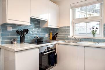 The stylish kitchen is light and airy.