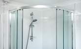 There is a large corner shower.  - Thumbnail Image