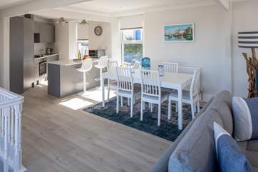 Step inside from the balcony into this fabulous kitchen/dining area.