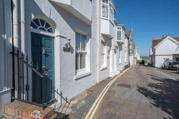 The sea is visible from the road outside Winkle Cottage.