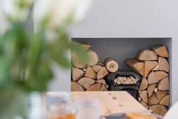 The ornamental fireplace is the centre piece of the living space.