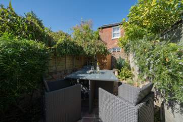 The pretty garden catches the midday sun.