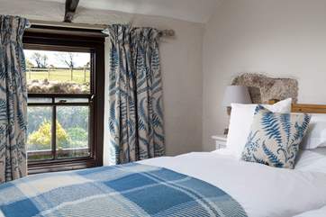 Pretty bedroom 2 overlooks the garden.