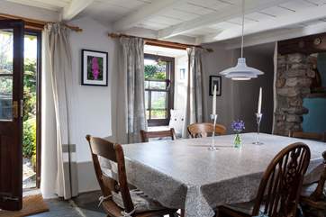 Arrive and enter into the spacious dining-room, which acts as the hub of the house.