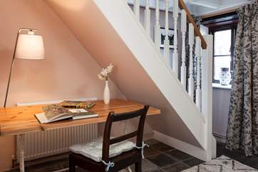 If you need to check in with the outside world, there is a useful desk located in the snug room.