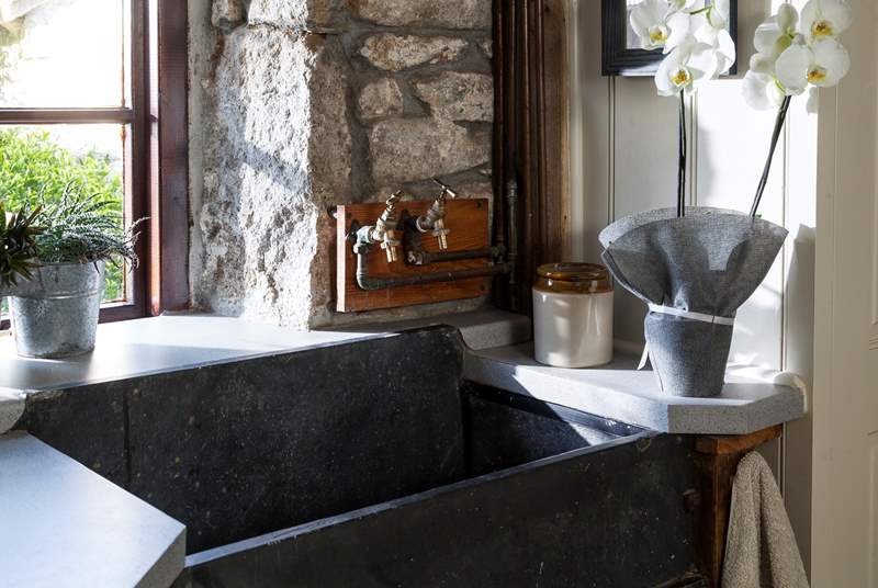 The characterful slate sink in the utility-room.