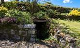 There is a tunnel in the garden, which the owner has screened off, please take care with children and dogs. Locally we call these fogou's and they are said to be Iron Age. - Thumbnail Image