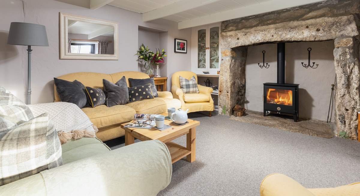 Take a step up into the cosy sitting-room with wood-burning stove and logs are provided for the entirety of your stay.