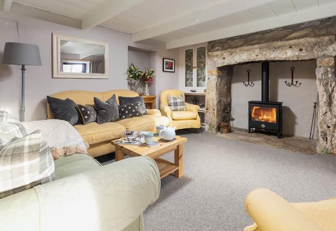 Take a step up into the cosy sitting-room with wood-burning stove and logs are provided for the entirety of your stay.