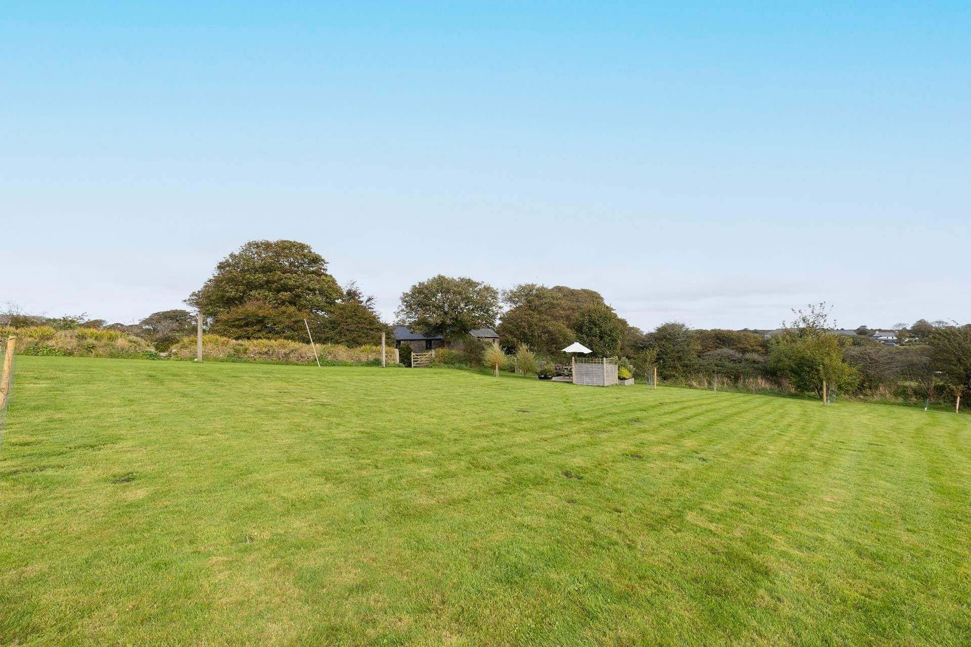 An abundance of land is attached to this captivating farmhouse.