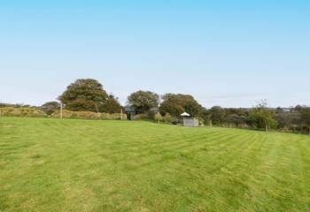 An abundance of land is attached to this captivating farmhouse.