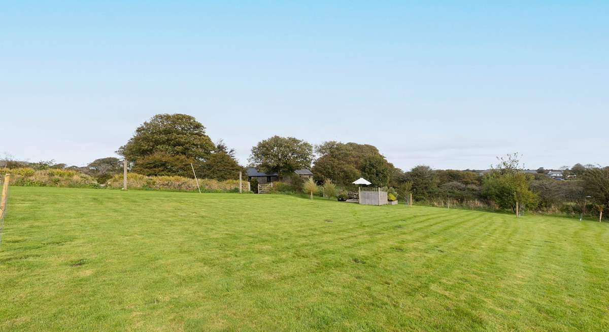 An abundance of land is attached to this captivating farmhouse.