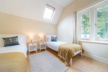 The bright and airy twin bedroom on the first floor.