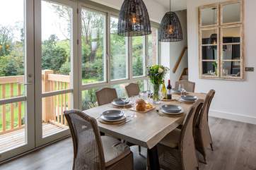The dining-area is such an inviting place to feast together and share the events of the day. When it is time for bed, the stairs to bedroom 4 lead up from the kitchen.