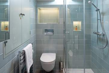 The en suite to bedroom 4 offers a large shower.