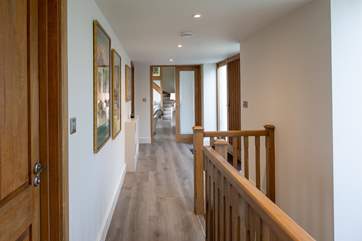 Looking from the kitchen and dining area through to the living area.