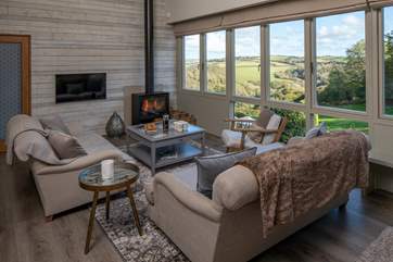 The living area is the perfect place to relax and unwind following a fun-packed day, especially with a full Sky package available along with the glorious wood-burner.