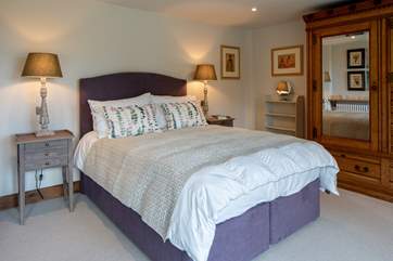 Bedroom 1 is home to this super inviting king-size bed.