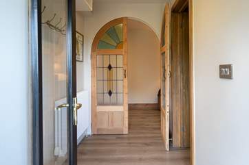 Even the porch and entrance hall to this beautiful barn is super attractive.