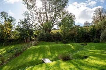 The quirkiness of the garden is also charming. Please take care with little ones when roaming in the garden due to the brook which runs through it.
