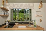 The kitchen is well-equipped with everything you'll need for your glamping getaway.