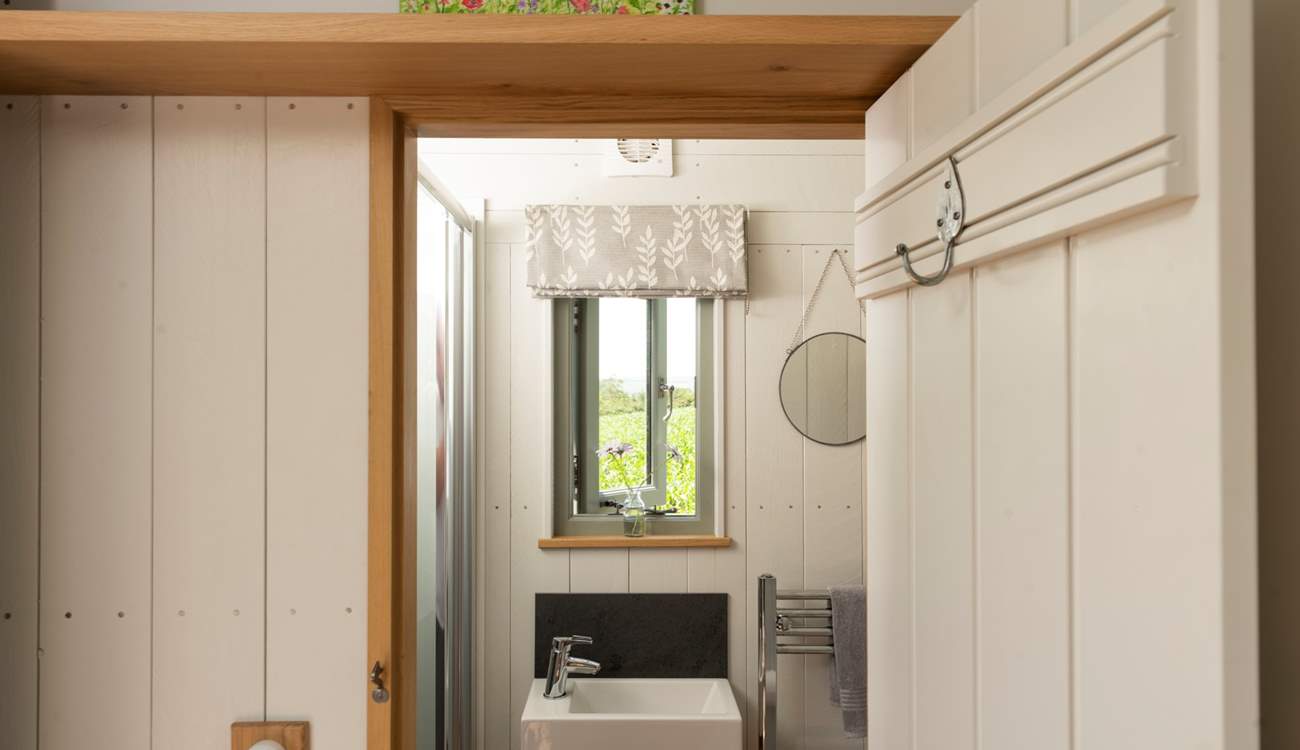 The shower-room sits to the left of the hut. 