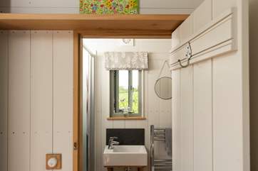 The shower-room sits to the left of the hut.