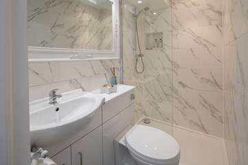 The shower-room is home to another glorious walk-in shower cubicle.
