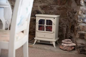 For the chiller evenings, pop on the wood-burner effect fire. You'll be toasty in minutes.