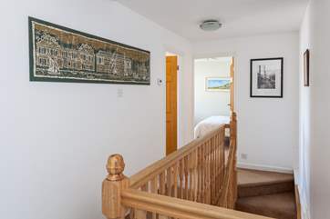 Up the stairs to the master bedroom ahead and the bathroom on the left.