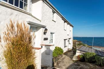 Bank Cottage overlooks Porthallow beach.